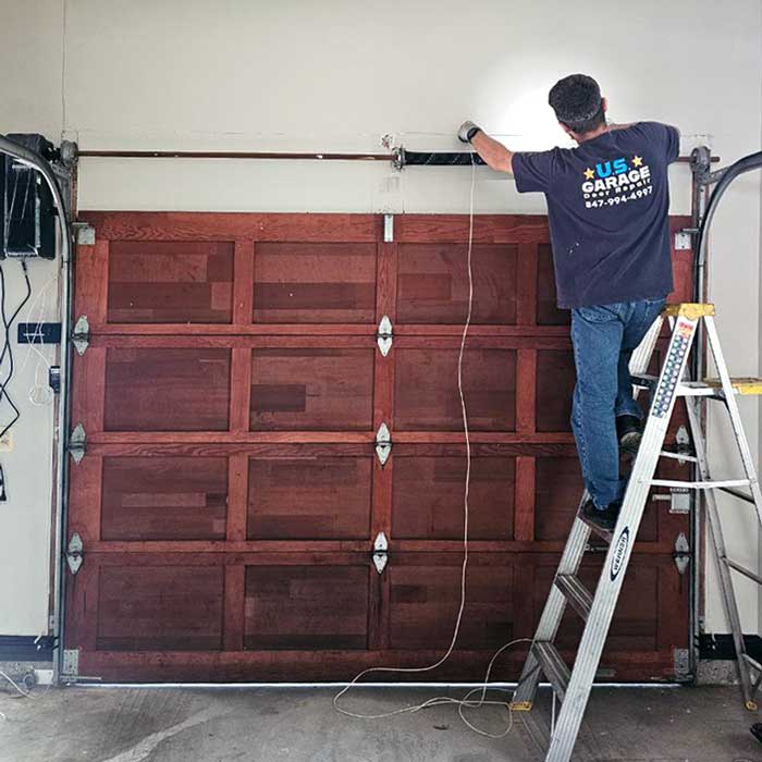 US Garage Door Repair technician performing emergency garage door repair Barrington IL